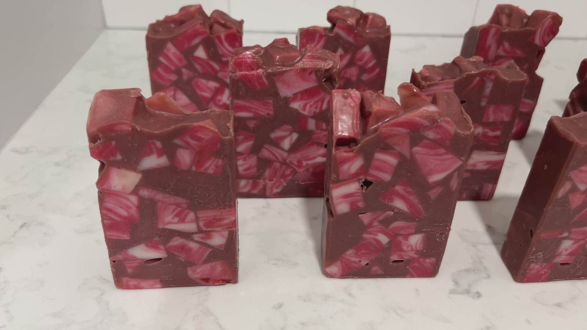 Bars of soap made up of red and white cubes, with brick red filling in the gaps. The soap is inspired by Rok-Tahk, the Brikar, from Star Trek: Prodigy. It smells like red berries and rhubarb.