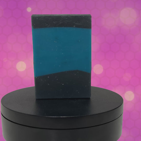 A bar of blue and black soap inspired by the iconic uniforms worn on Star Trek: The Next Generation. The scent is mint frosting, AKA spearmint, in honor of the time Troi became a cellular peptide cake with mint frosting.