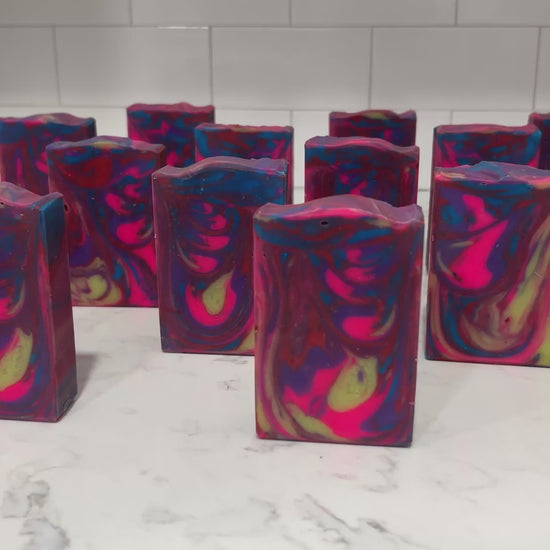 The swirled colors in this soap are inspired by the bright colors of Jake Sisko's attire on Star Trek: Deep Space Nine. The scent is "orange paradise," a ray of sunshine for your sonic shower!