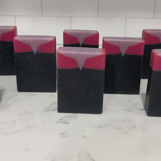 Bars of black, red, and purplish-grey soap inspired by Captain Kathryn Janeway from Star Trek: Voyager. It is scented with an espresso martini fragrance.