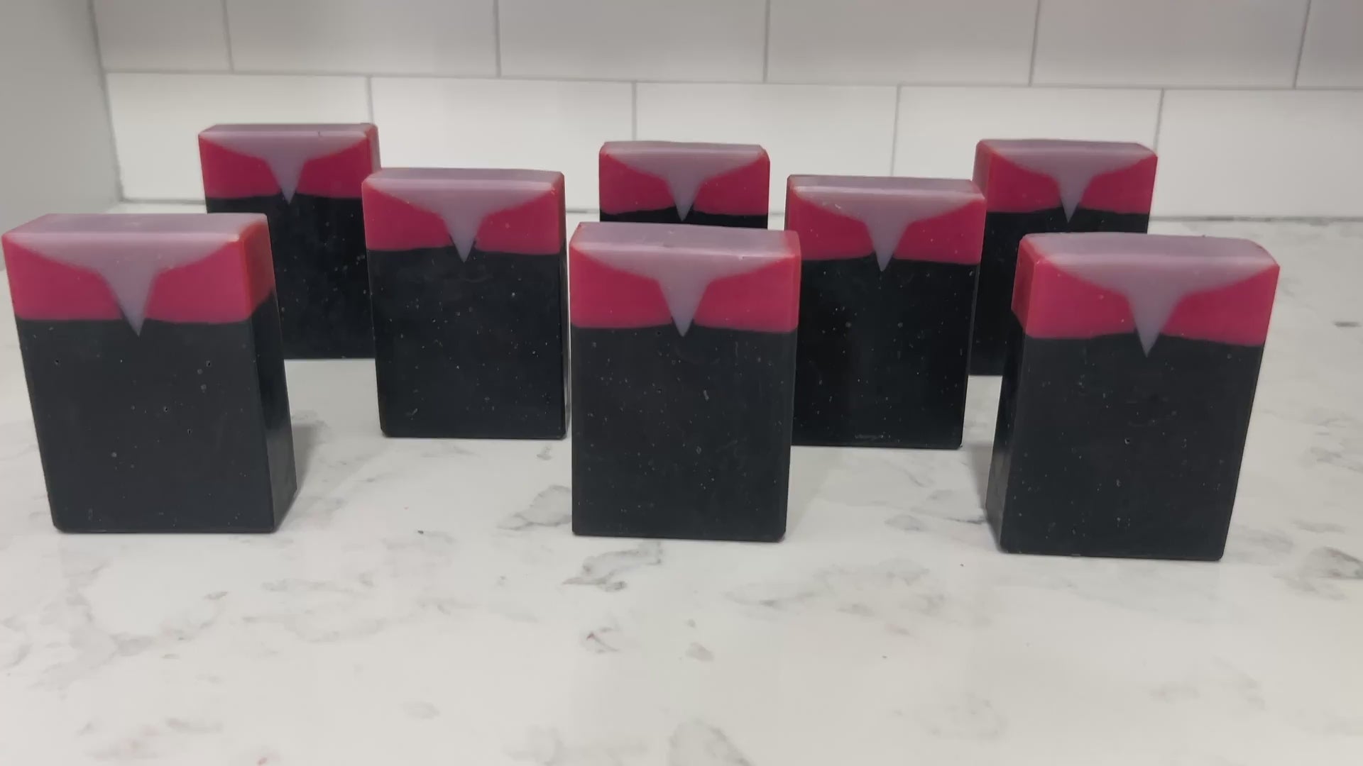 Bars of black, red, and purplish-grey soap inspired by Captain Kathryn Janeway from Star Trek: Voyager. It is scented with an espresso martini fragrance.