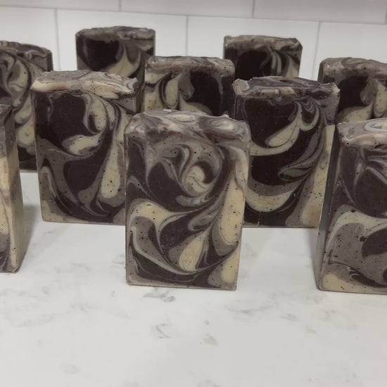 Bars of coffee soap with various shades of brown and cream-colored swirls. They smell like a cafe latte, and they are inspired by Captain Janeway's obsession with coffee on Star Trek: Voyager and Star Trek: Prodigy.