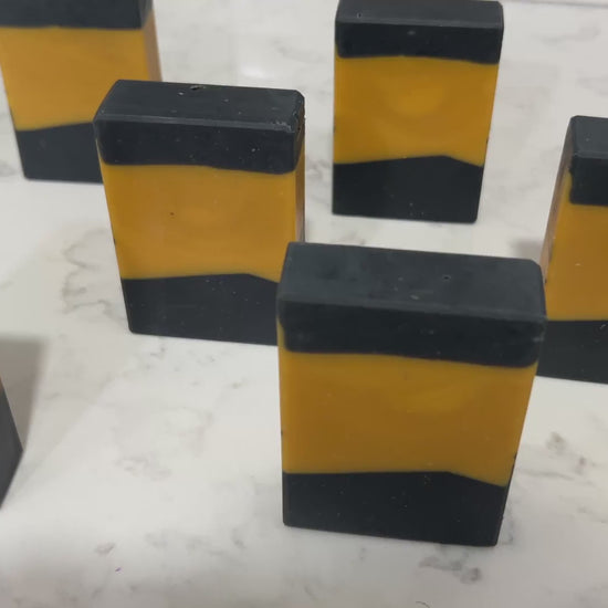 Bars of gold and black soap inspired by the design of the uniforms on Star Trek: TNG. This soap is scented with a fragrance called Blue Skies, in honor of Data's famous rendition of the song. It smells like clean cotton.