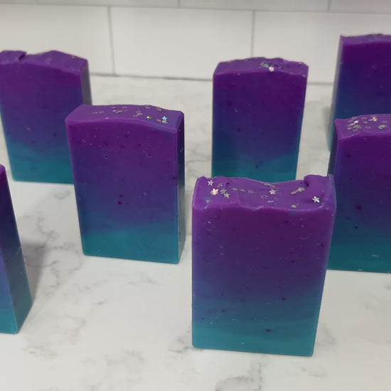 Gradient purple to blue soap bars on a white background. The colors are inspired by Murf from Star Trek: Prodigy, and the scent is fresh mango.