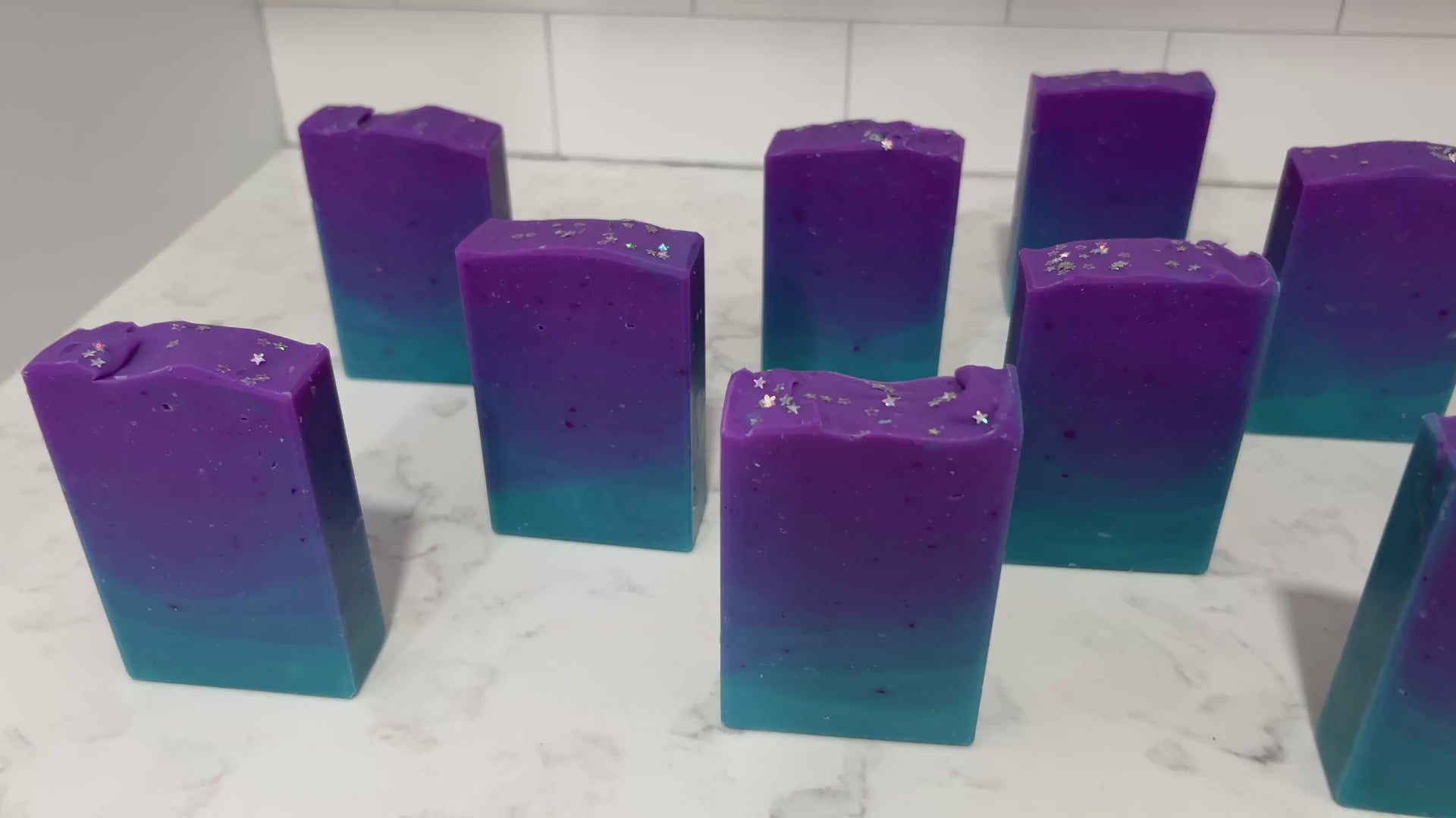 Gradient purple to blue soap bars on a white background. The colors are inspired by Murf from Star Trek: Prodigy, and the scent is fresh mango.