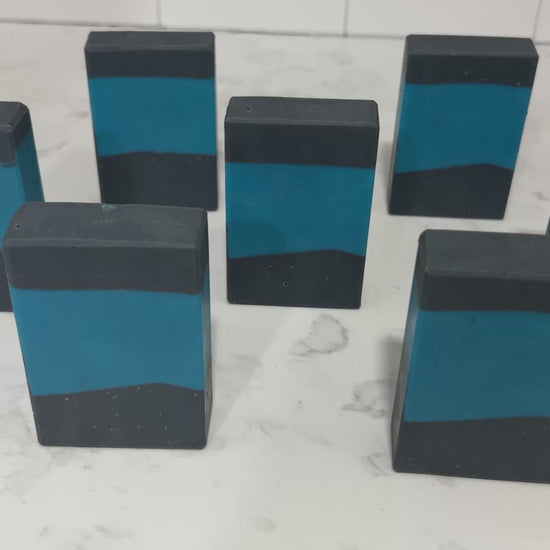 Bars of blue and black soap inspired by the design of the iconic uniforms worn on Star Trek: The Next Generation. The scent is wild rose in honor of Dr. Beverly Crusher.