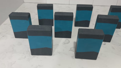 Bars of blue and black soap inspired by the design of the iconic uniforms worn on Star Trek: The Next Generation. The scent is wild rose in honor of Dr. Beverly Crusher.