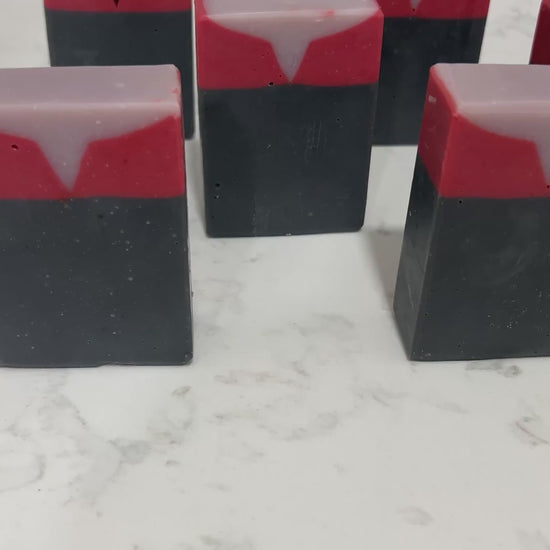 Bars of black, red, and purplish-grey soap inspired by Captain Kathryn Janeway from Star Trek: Voyager. It is scented with an espresso martini fragrance.