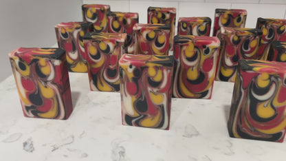 Bars of red, white, gold and black drop swirled soap, representing the colors of the Klingon Empire flag. The soap is scented with a blood orange fragrance.