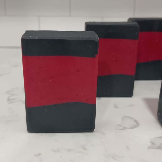Bars of red and black soap inspired by the iconic uniforms worn on Star Trek: The Next Generation. The scent is Earl Grey tea, Captain Picard's favorite beverage.
