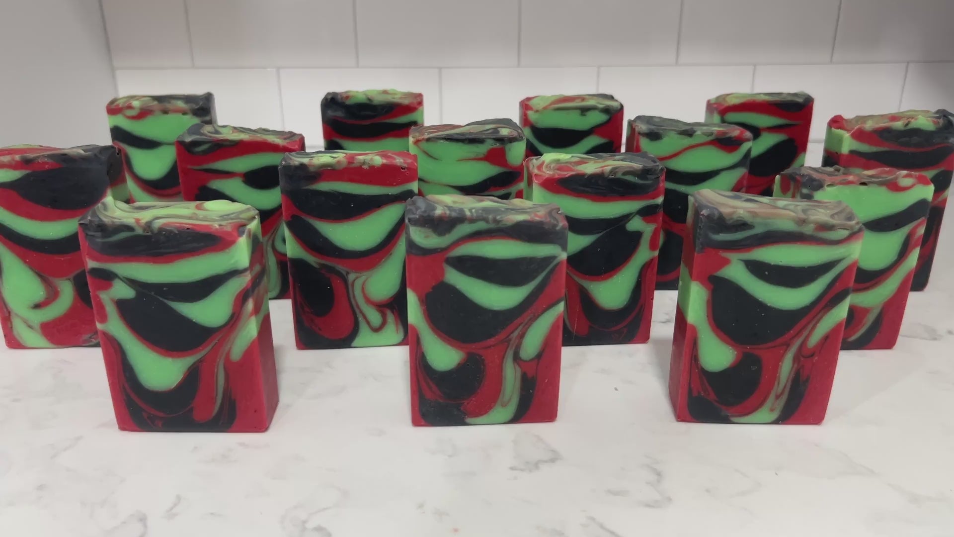 Bars of soap with drop swirls of red, black and green, inspired by the colors of Uhura's uniform and her iconic hoop earrings.