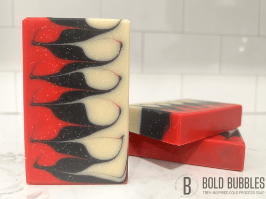 A red, black and white bar of soap made with a Taiwanese swirl pattern, inspired by the character Q from Star Trek: The Next Generation.