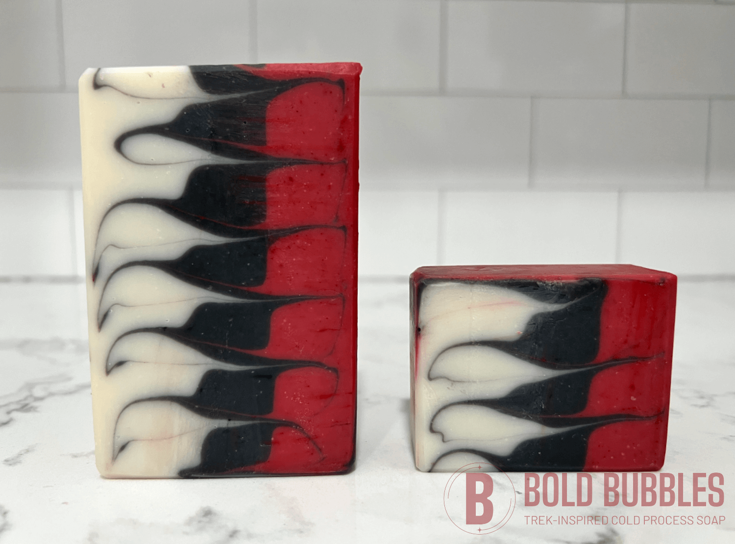 Red, black and white bars of soap inspired by Q from Star Trek.