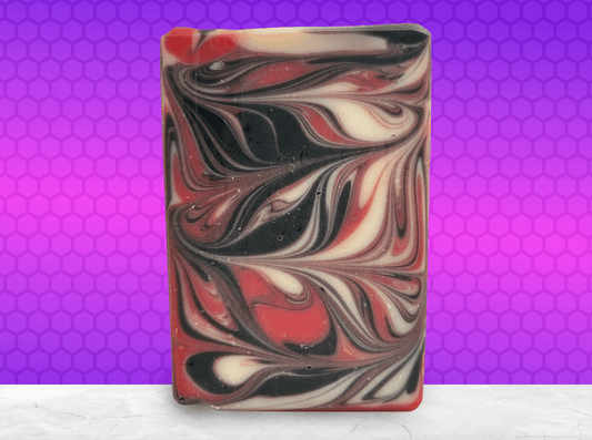A red, black and white swirled bar of soap inspired by Q from Star Trek.
