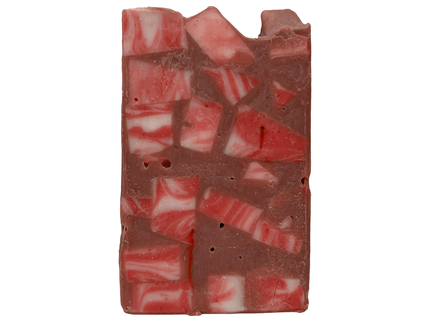 A bar of soap made up of red and white cubes, with brick red filling in the gaps. The soap is inspired by Rok-Tahk, the Brikar, from Star Trek: Prodigy. It smells like red berries and rhubarb.