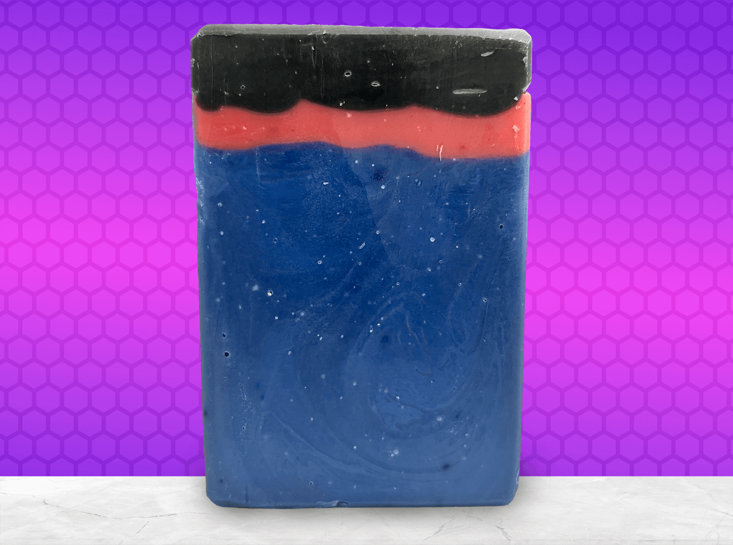 A bar of blue, red and black soap inspired by the uniforms worn on the show Star Trek: Enterprise. The Kentucky bourbon scent is inspired by Trip and Reed's near-death experience in the episode "Shuttlepod One."