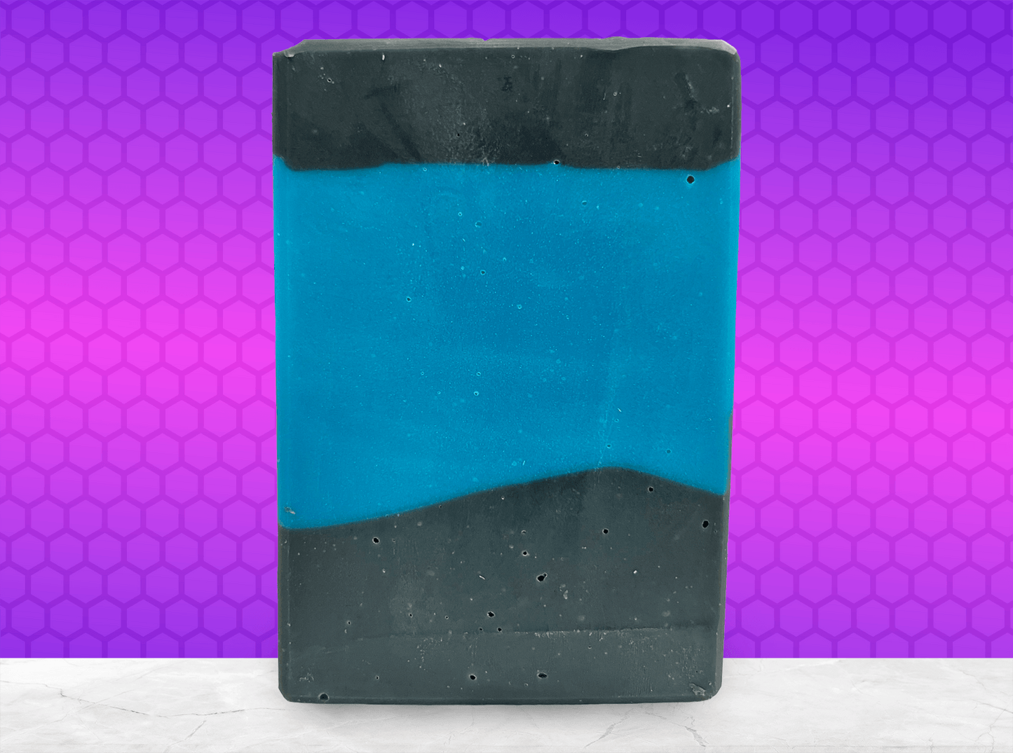 A bar of blue and black soap inspired by the iconic uniforms worn on Star Trek: The Next Generation. The scent is mint frosting, AKA spearmint, in honor of the time Troi became a cellular peptide cake with mint frosting.