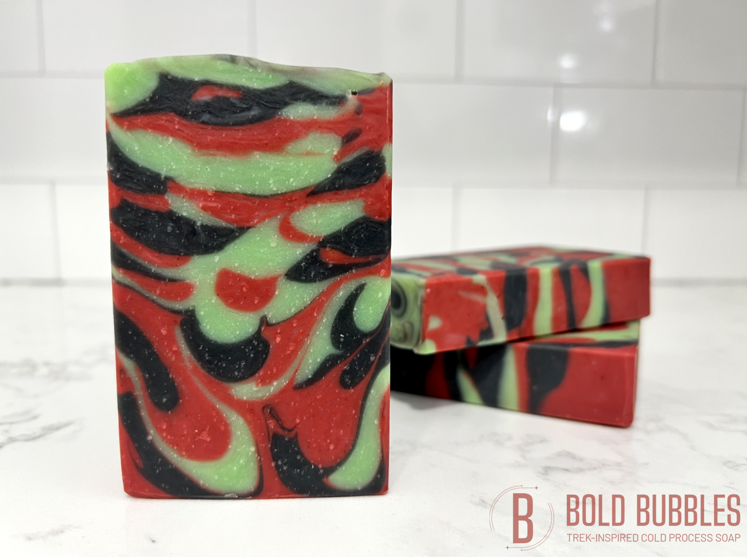 A bar of soap with swirls of red, black and green, inspired by Uhura from Star Trek.