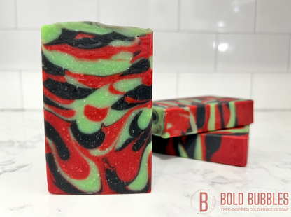 A bar of soap with swirls of red, black and green, inspired by Uhura from Star Trek.