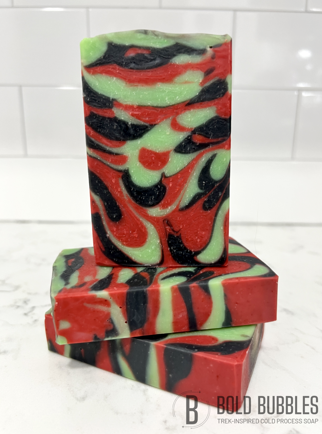 A bar of soap with swirls of red, black and green, inspired by Uhura from Star Trek.