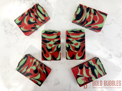 A bar of soap with swirls of red, black and green, inspired by Uhura from Star Trek.