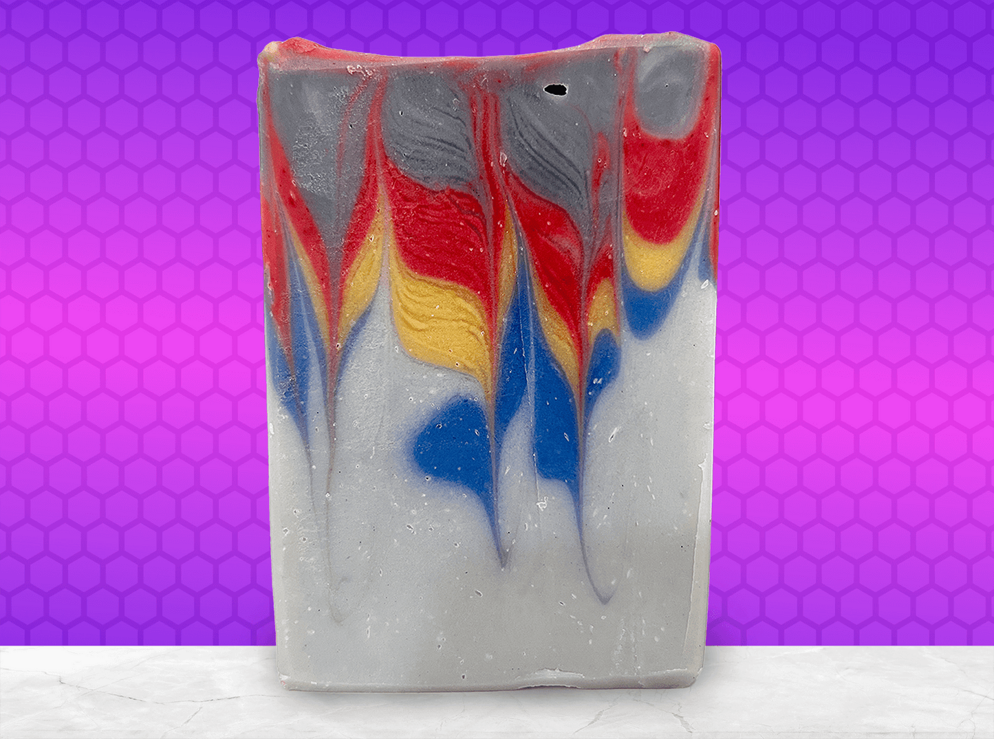 A bar of soap inspired by the grey, blue, yellow, and red sweater Wesley Crusher wore in Star Trek: The Next Generation. The scent is a dynamic unisex blend of citrus, floral, and earthy notes.